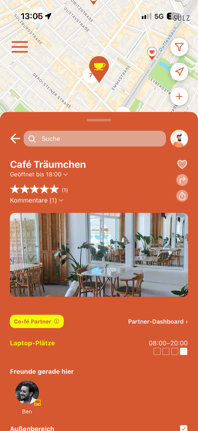Co•fé app showing a partner café profile with live laptop seats